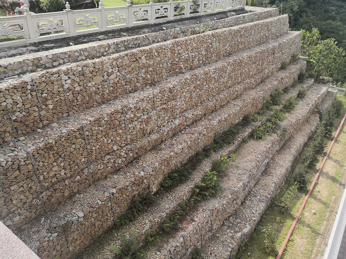 double twist woven gabion baskets installed as a stone retaining wall