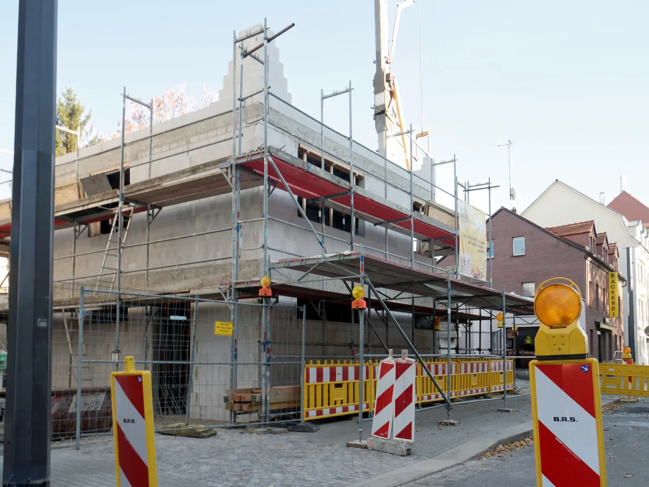 temporary fence panels installed at a construction site with system accessories