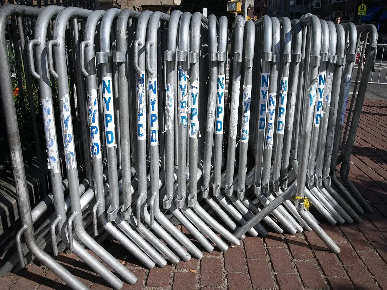 stacked galvanized crowd control barriers with interlocking feet