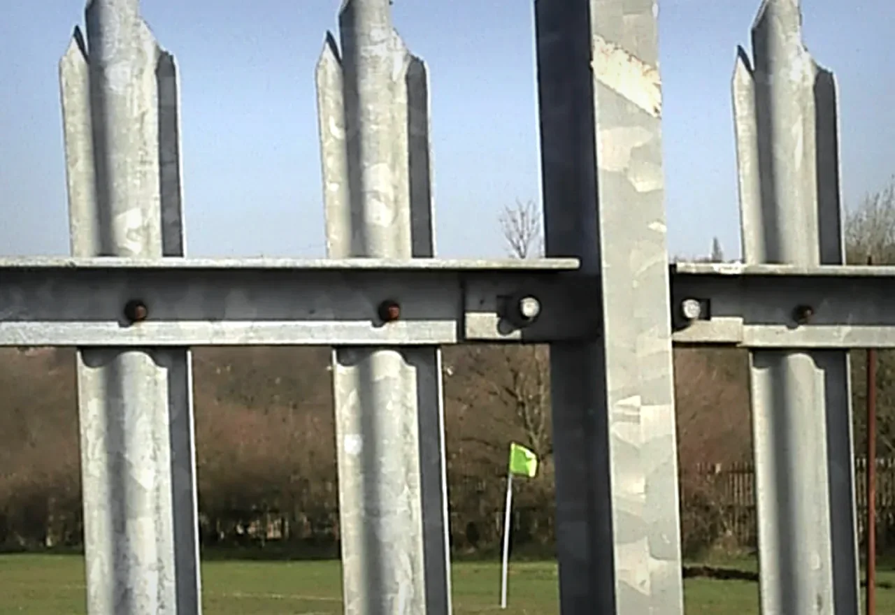 steel palisade security fence with vertical pales rails posts and bolts